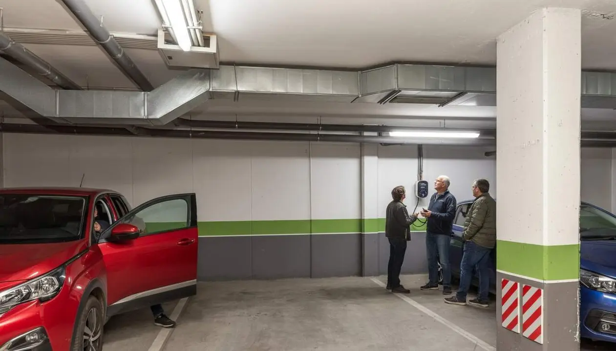  Tribunal Suprem confirma que no es pot prohibir la instal&middot;laci&oacute; de punts de rec&agrave;rrega per a cotxes el&egrave;ctrics a comunitats de ve&iuml;ns &mdash; Imagen generada por IA 