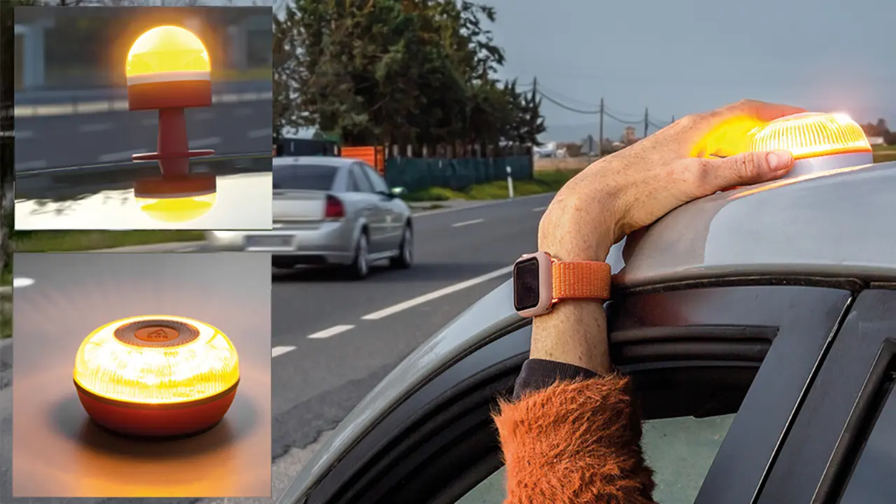 Balisa V16 connectada sobre el sostre d&rsquo;un cotxe aturat, llum groga intermitent visible a 1 km