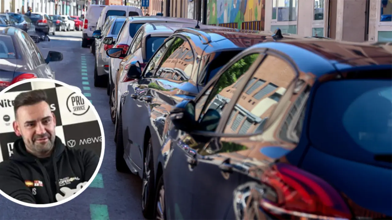 Cotxes aparcats en l&iacute;nia amb focus a roda tocant el voral