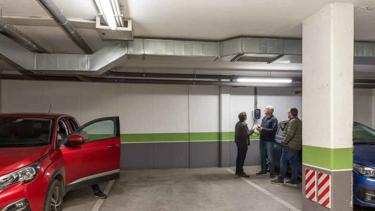  Tribunal Suprem confirma que no es pot prohibir la instal&middot;laci&oacute; de punts de rec&agrave;rrega per a cotxes el&egrave;ctrics a comunitats de ve&iuml;ns &mdash; Imagen generada por IA 