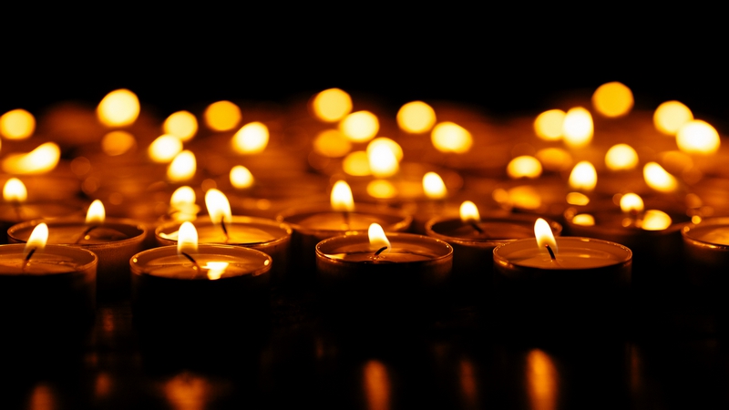 Candles. Set of lighting candles in dark. Selective focus